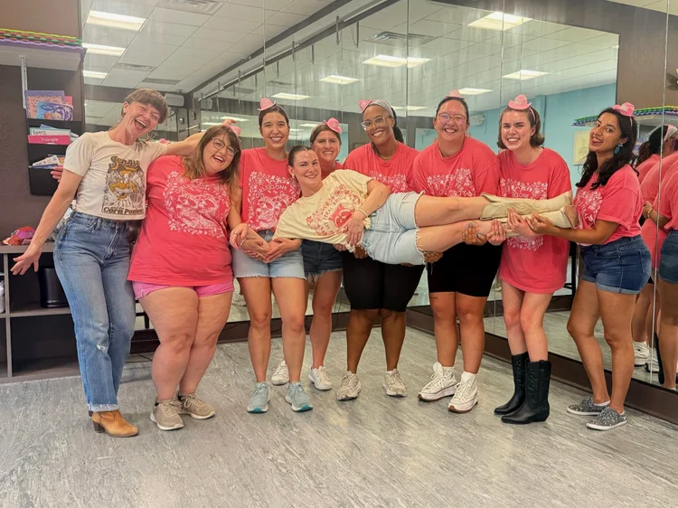 An Austin bachelorette group in cowboy hats at a Double or Nothing line dance lesson
