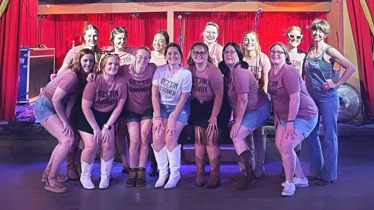 A bachelorette group at an Austin honky-tonk line dance lesson