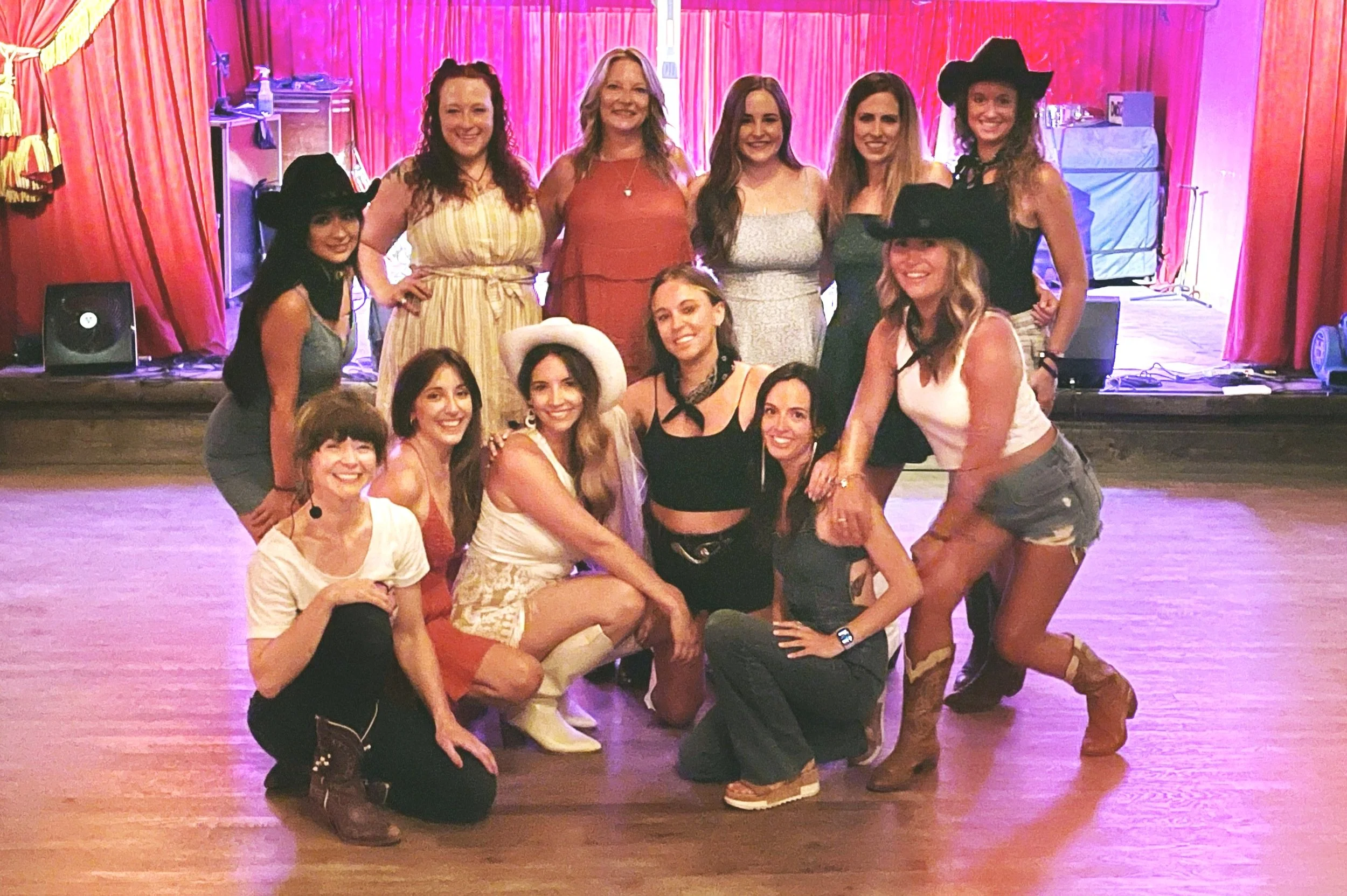 Large bachelorette group of 12-15 women line dancing at Austin venue