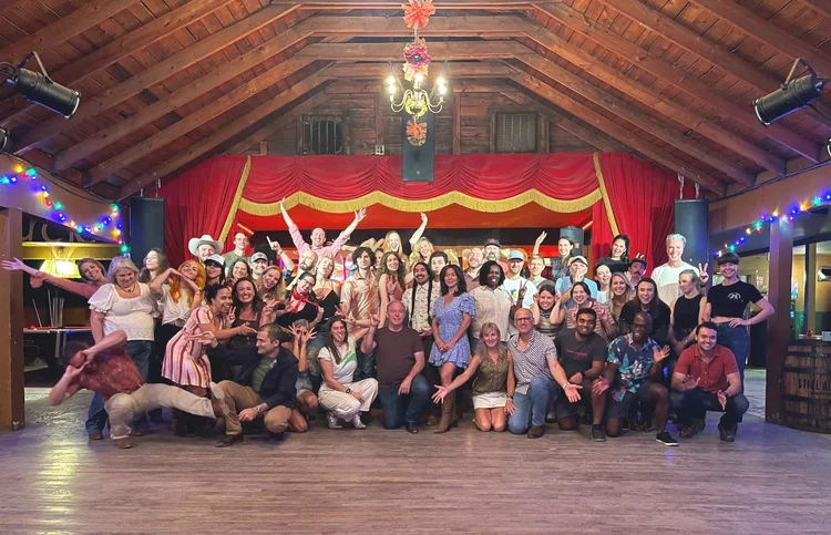 Corporate team line dance lesson at a Hill Country event