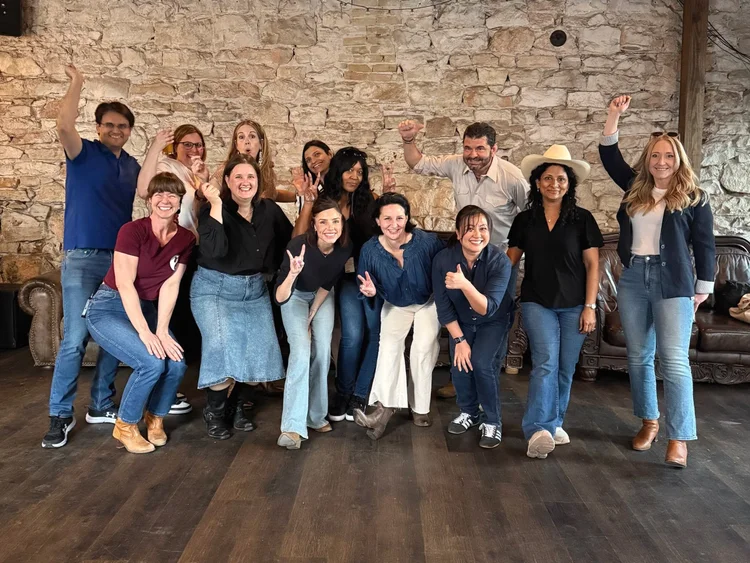 Employees line dancing at a company party in Austin, Texas
