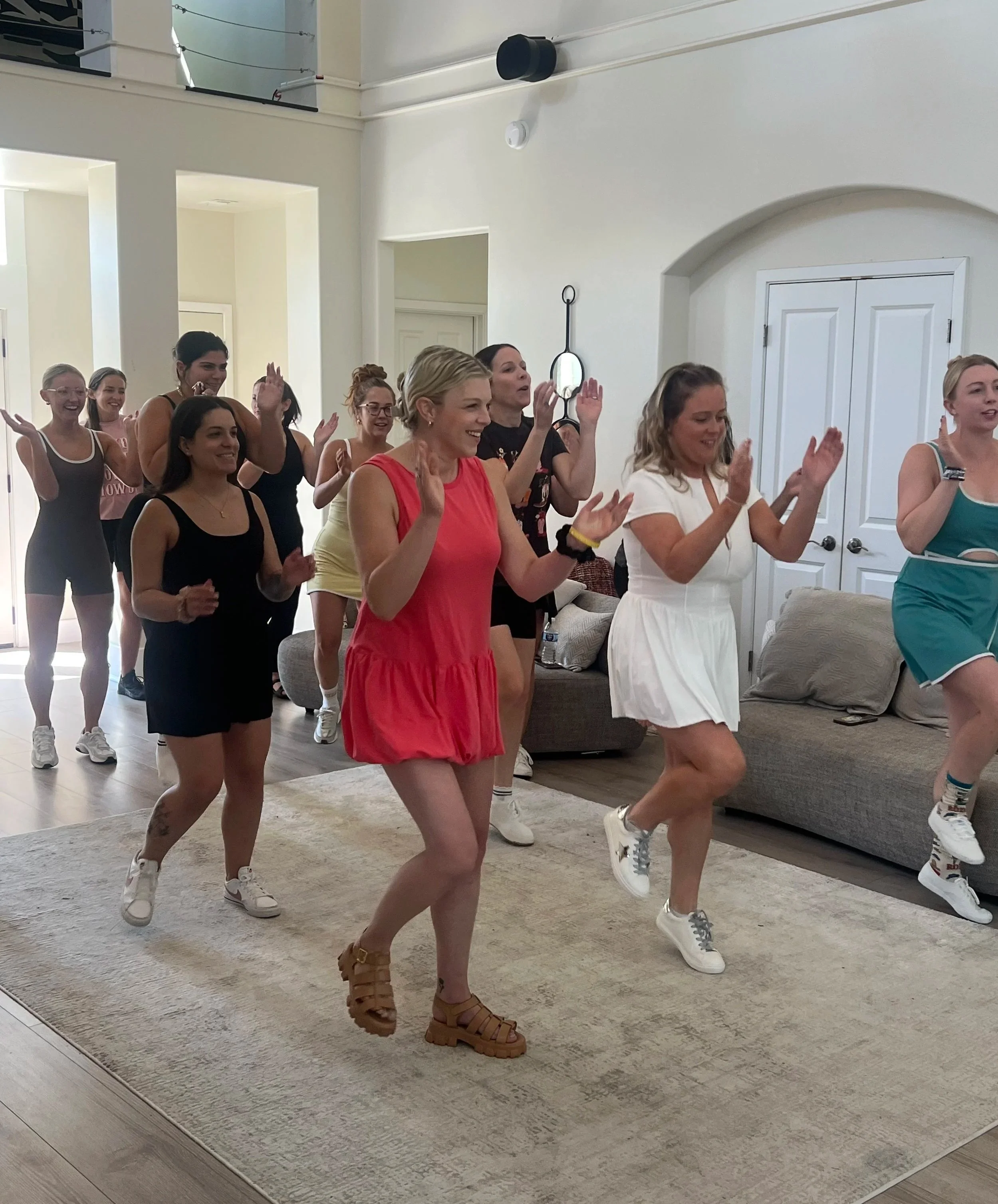 Group of women learning line dancing at authentic Austin honky-tonk for bachelorette weekend