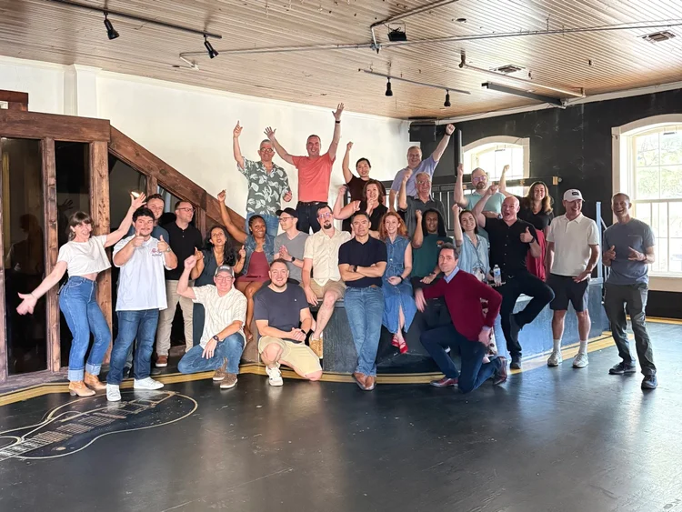 Corporate group line dancing together at an Austin event