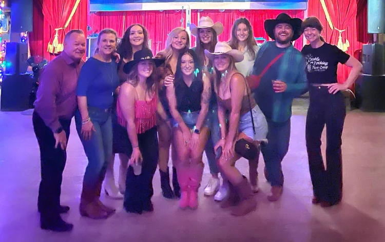 A joint bachelor and bachelorette group at an Austin line dance lesson