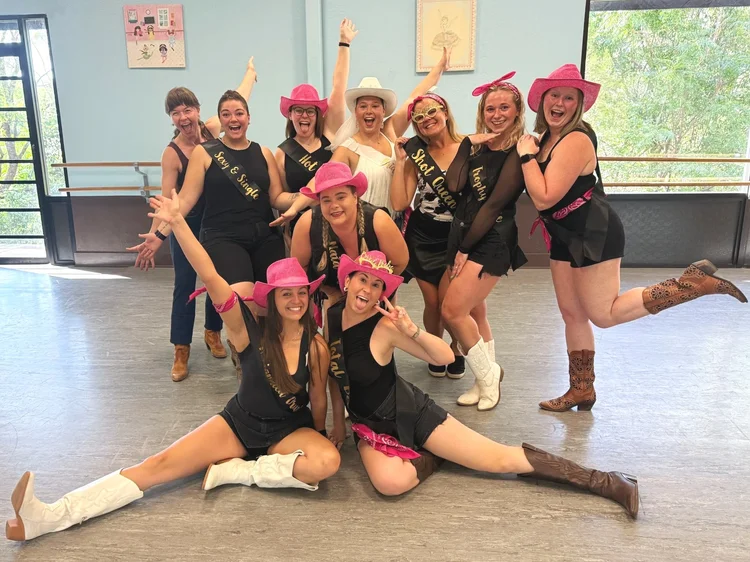 A bachelorette group having a blast at a Double or Nothing line dance lesson in Austin