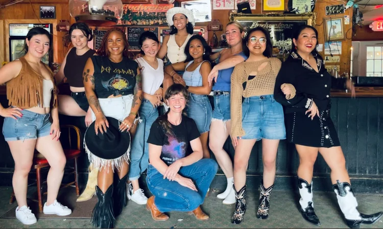 A bachelorette group celebrating a line dance lesson at an Austin honky-tonk