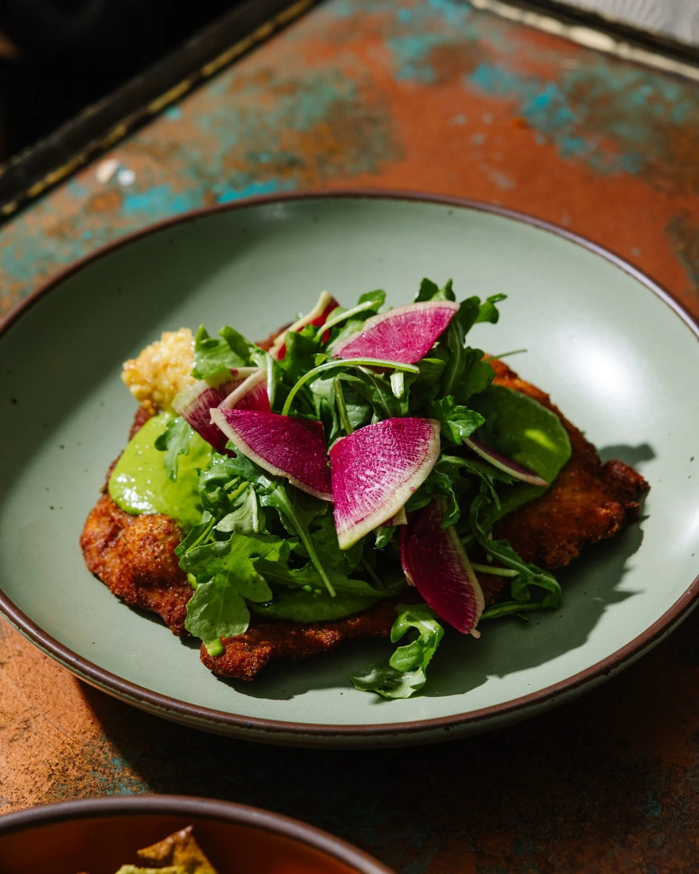 This is an imporkant message: you gotta try the #schnitzel 🐖 This comfort food classic features spicy greens, apple mostarda and celeriac with a touch of green goddess dressing!

#oysterbar #rawbar #dtr #raleigheats #foodie #raleighrawbar #raleighre