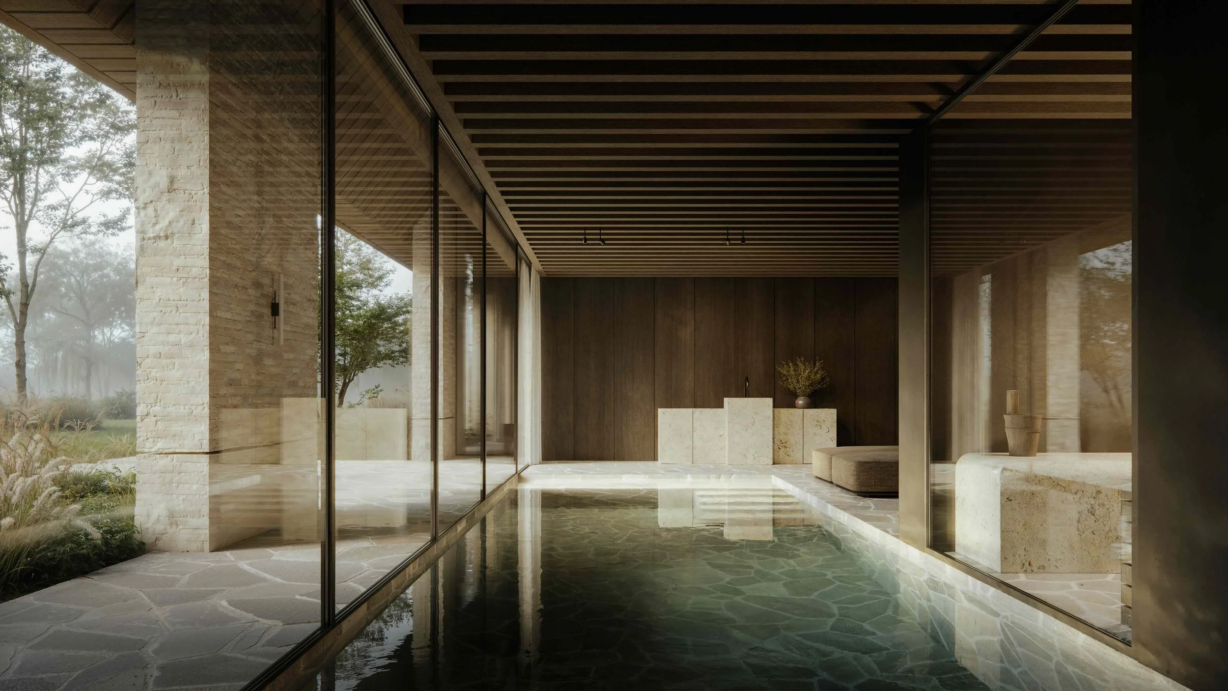 Interior view of a modern room with large glass windows, stone and wood walls, a reflecting water feature, and minimalist decor including a stone bench and potted plant.