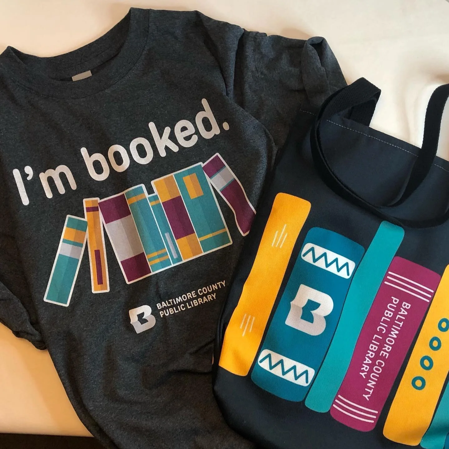 I ❤️ book merch! Check out my tee and matching tote. @bcplinfo @foundation4bcpl  Etsy.com/shop/BeAllInShop. #library #librariesofinstagram #readersofinstagram #readersofig #bookmerch #bookmerchandise #baltimorecountypubliclibrary #imbooked #authorsof