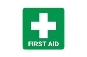 Green first aid sign with a white cross and the words 'FIRST AID' below.