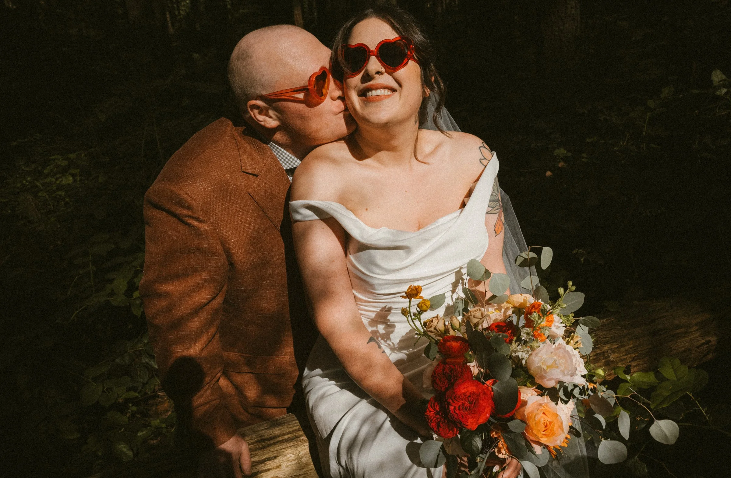 A happy couple eloping at Pacific Spirit Park in BC