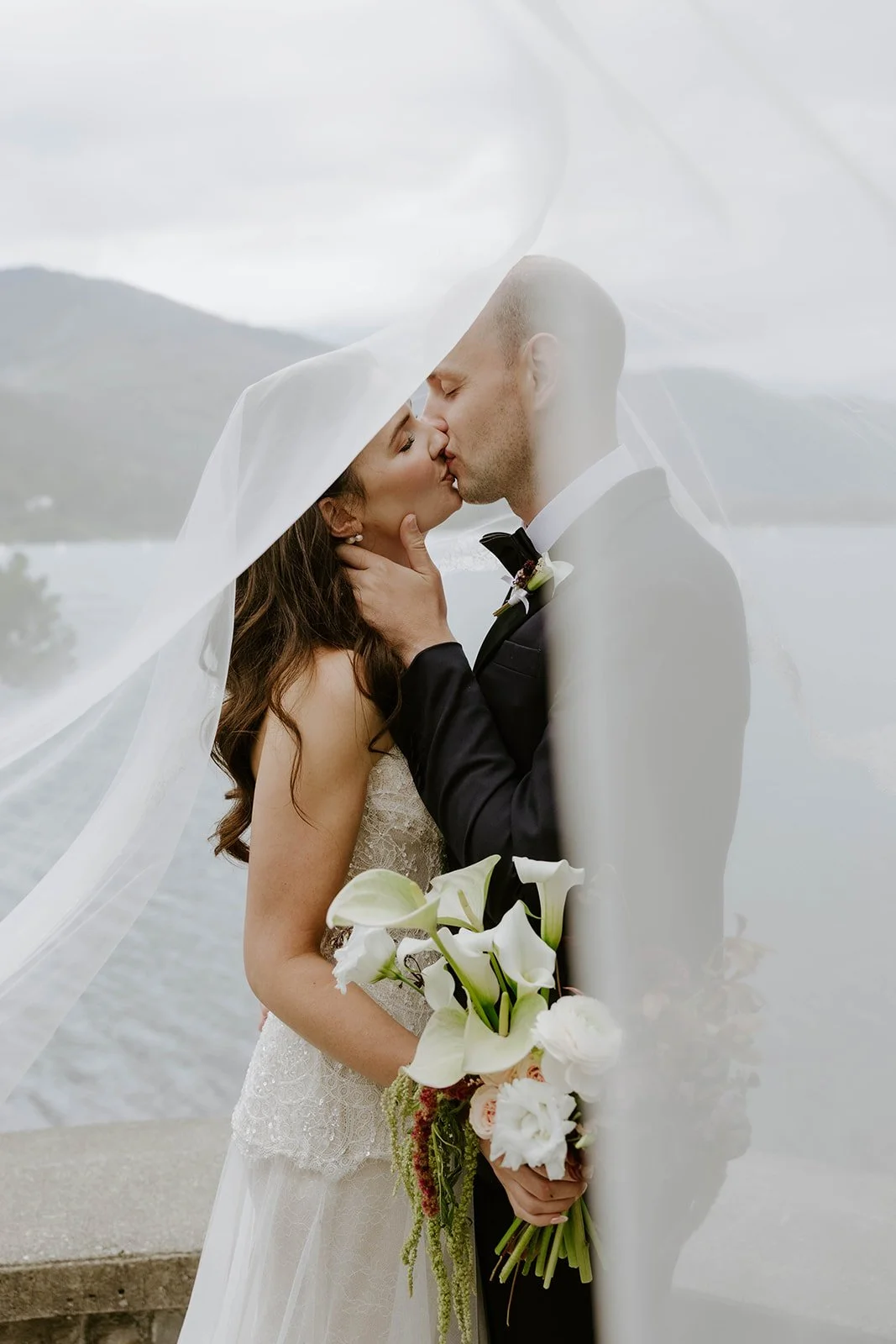 A bride and groom kiss during their Whistler elopement