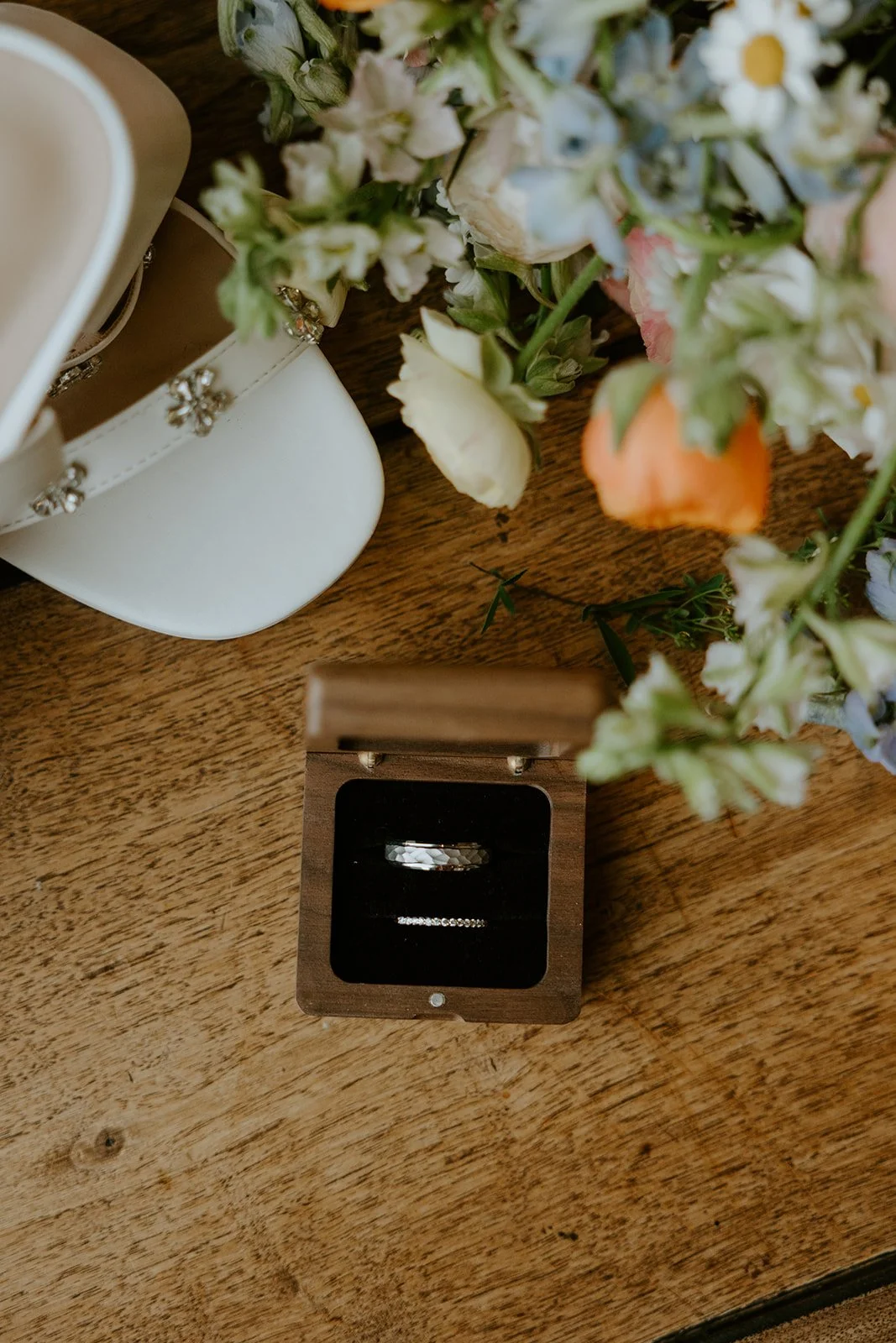A photo of an eloping couples' wedding rings
