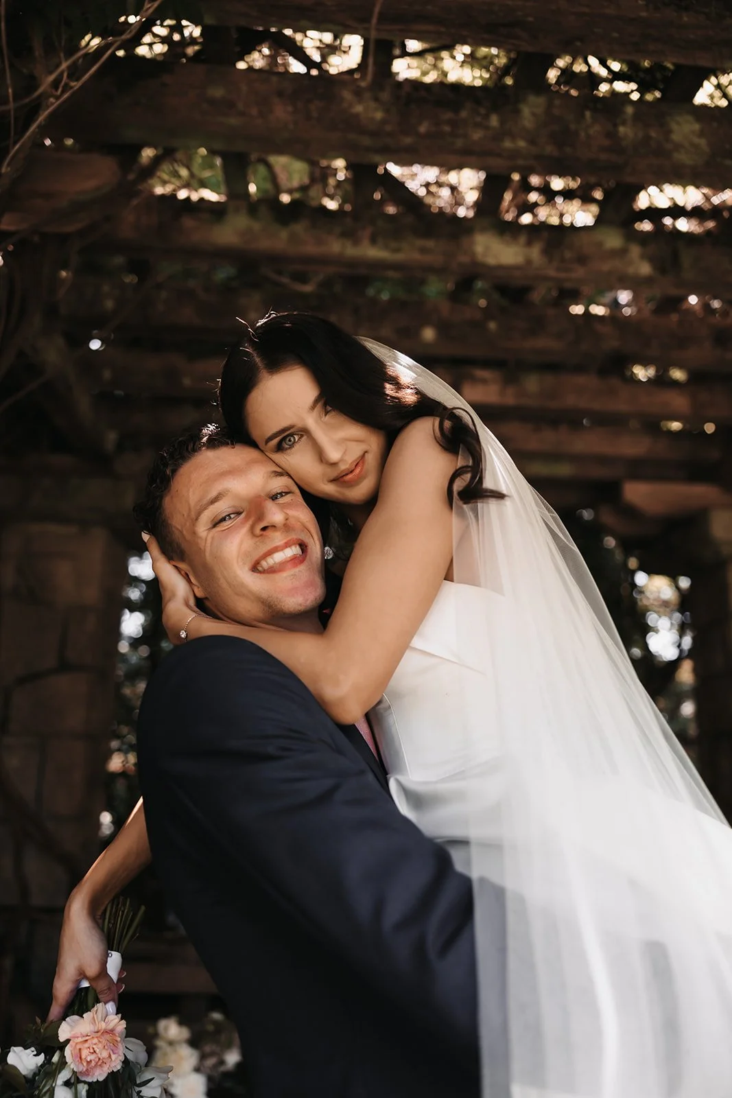A bride and groom happily eloping in BC
