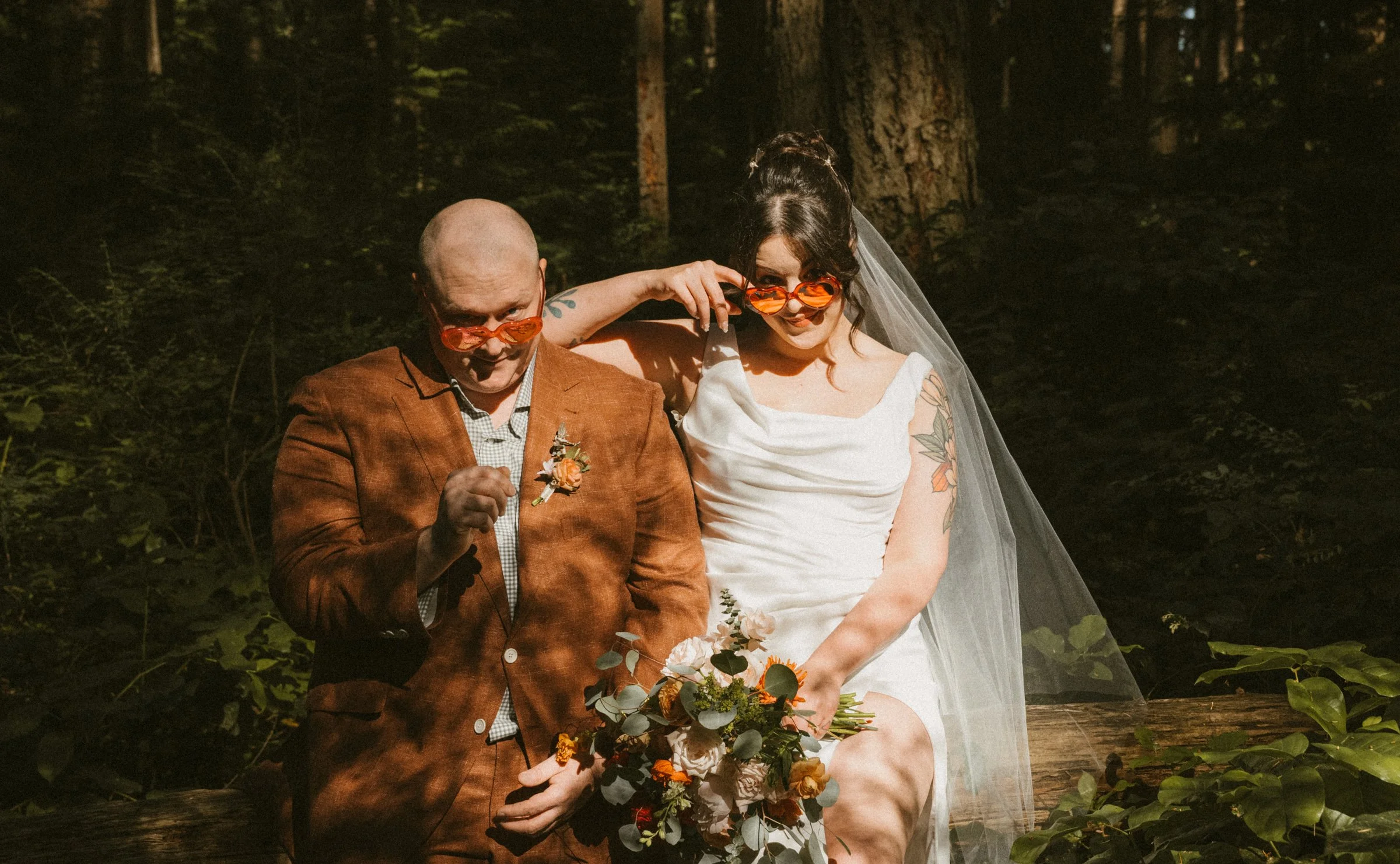 A couple eloping with heart shaped glasses