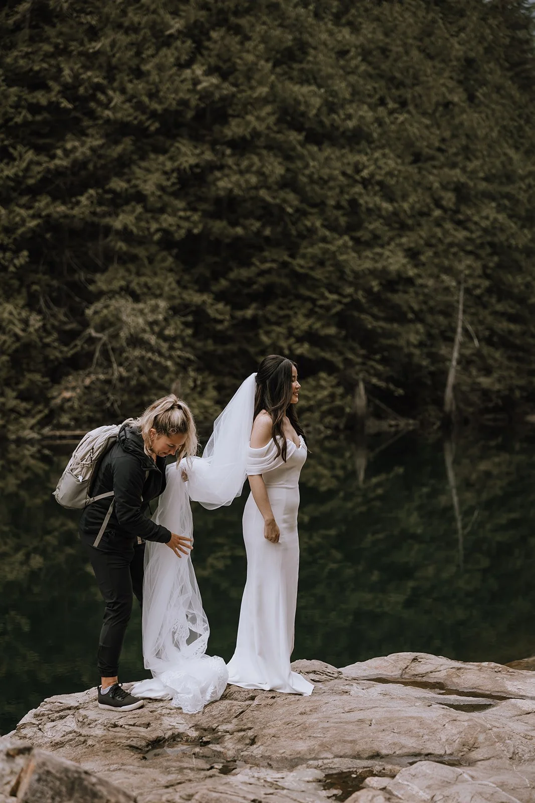 Jocelyn Bacon assists bride’s veil before lakeside elopement on the Sunshine Coast