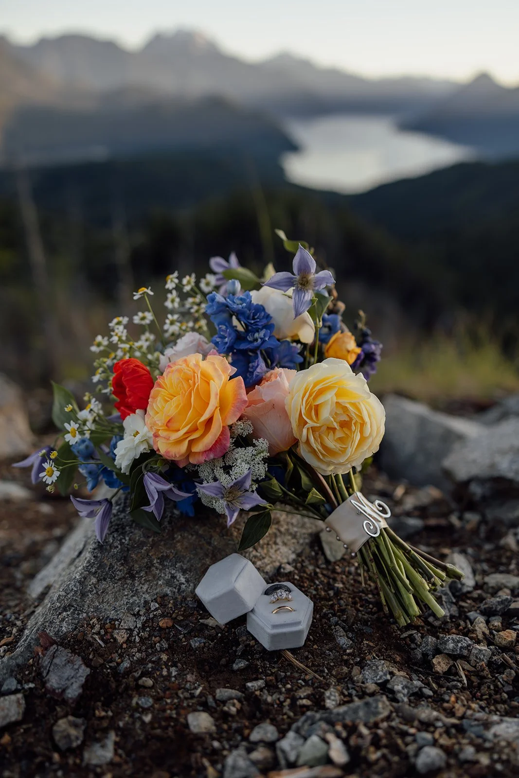The bride's beautiful bouquet, along with the couples wedding bands