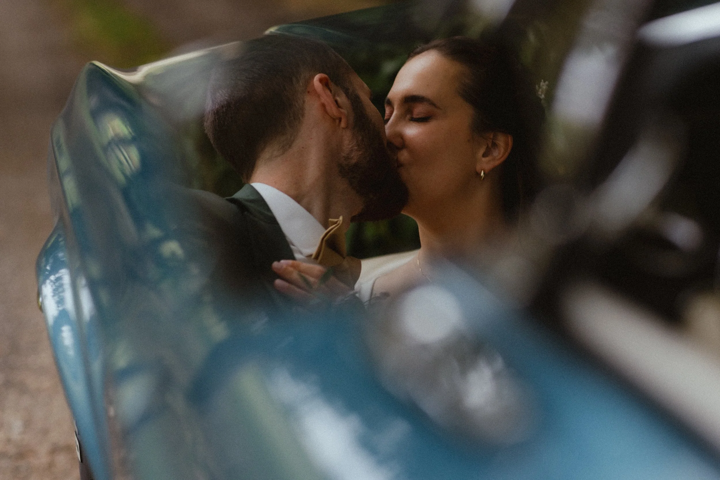 A newlywed couple kissing on their elopement day