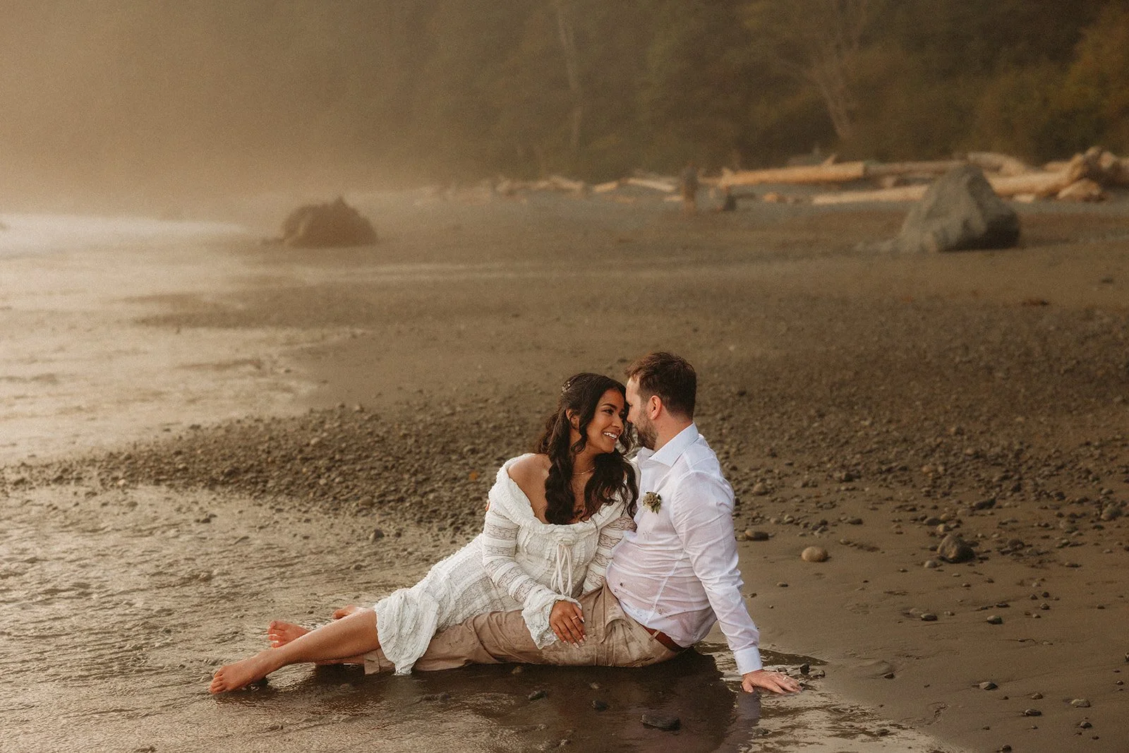 A happy couple eloping at Mystic Beach on Vancouver Island