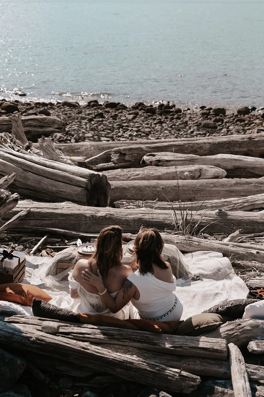Couple on rocky shore during their all-inclusive BC elopement.