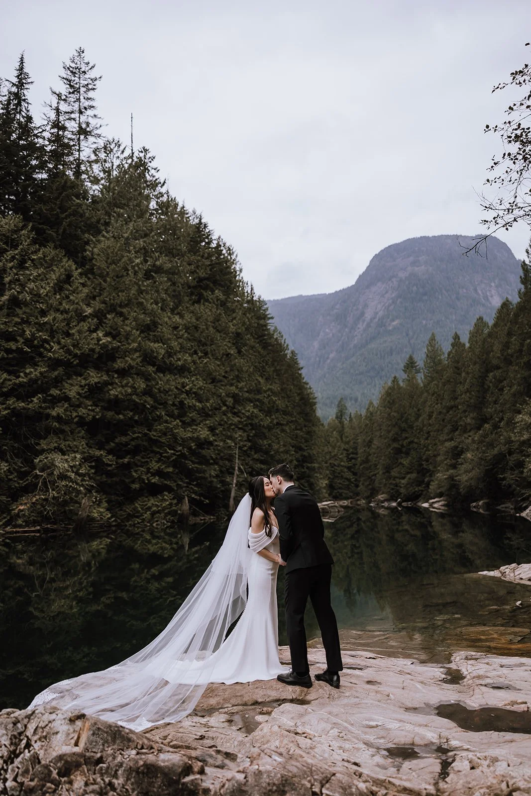 A bride and groom kissing during their elopement in Golden Ears Provincial Park