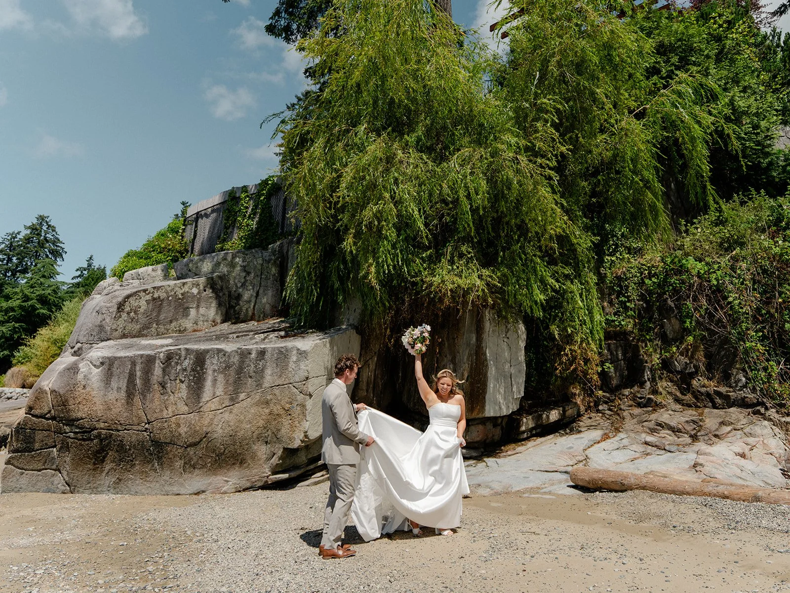 A bride holding up her bouquet during her Vancouver elopement