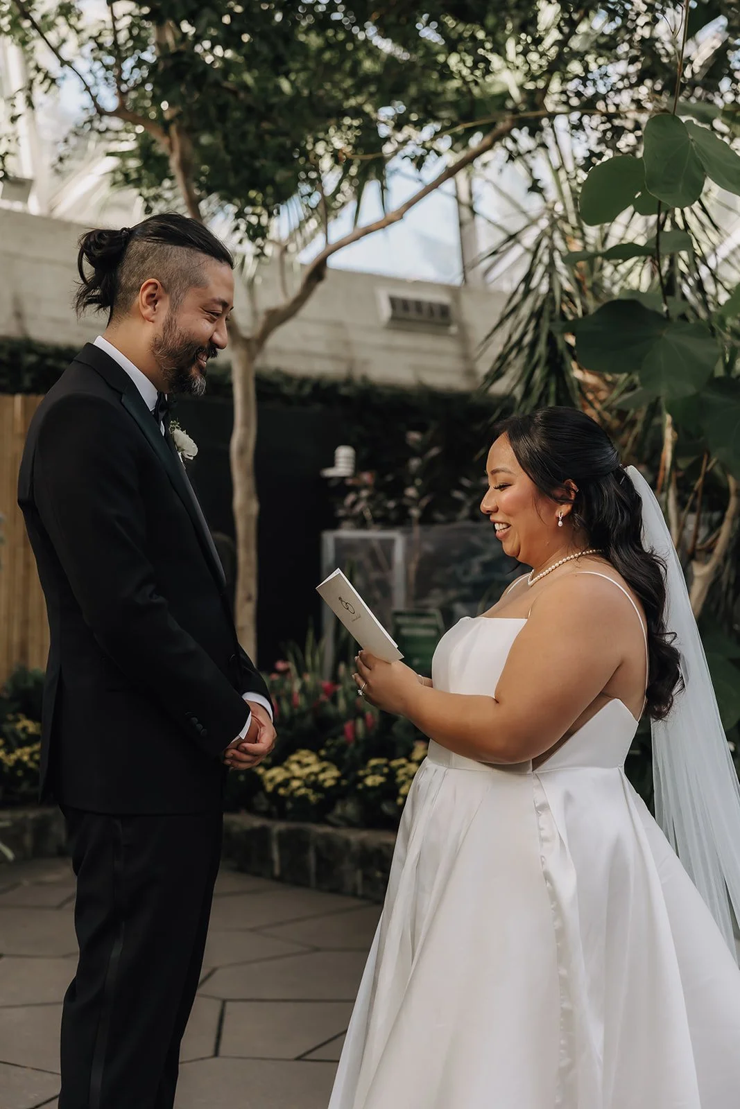 A couple exchanging vows at Bloedel Conservatory