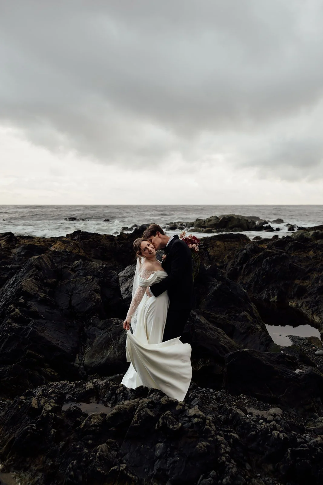 A bride and groom eloping in Tofino, during their helicopter elopement