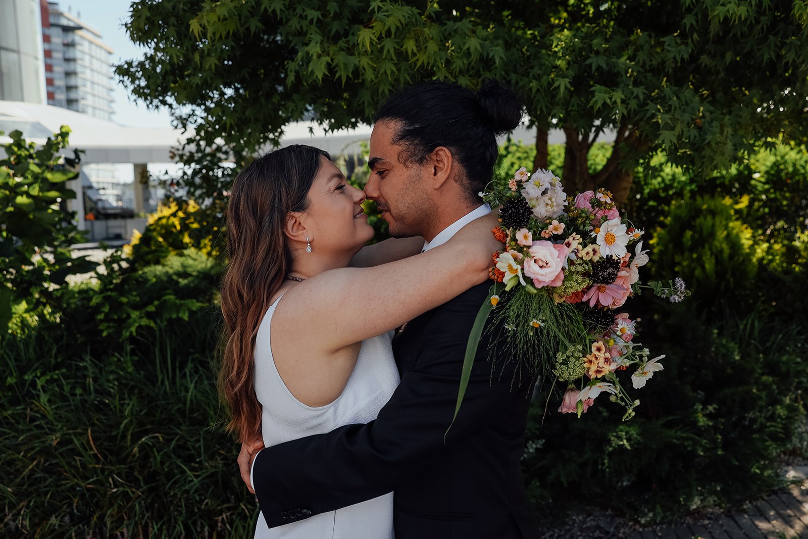 A bride and groom gazing into each other's eyes at their Vancouver elopement