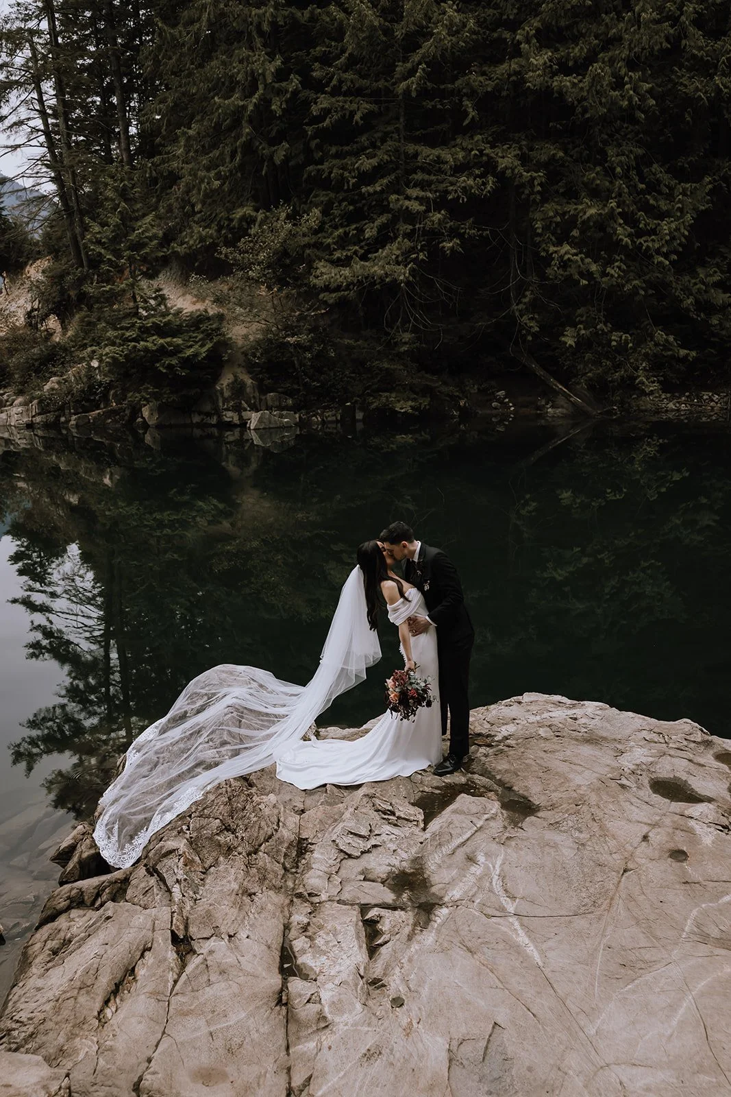A bride and groom kissing during their sunshine coast elopement.