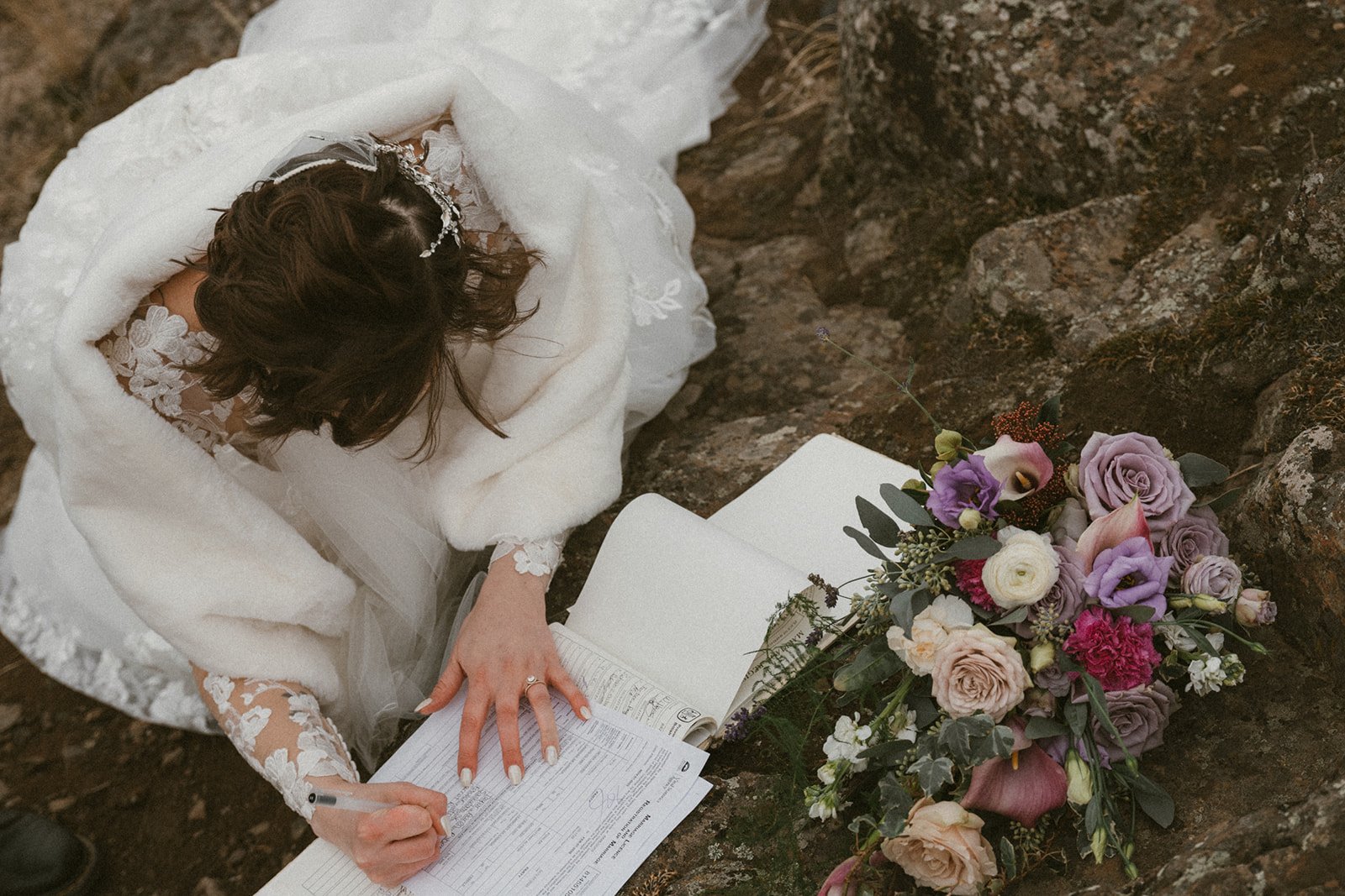 A bride signing her marriage papers during her BC elopement