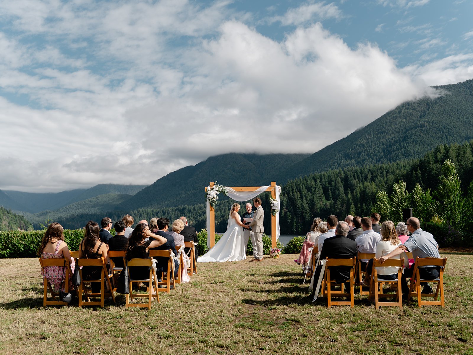 A bride an groom elope with the BC mountains in the background.
