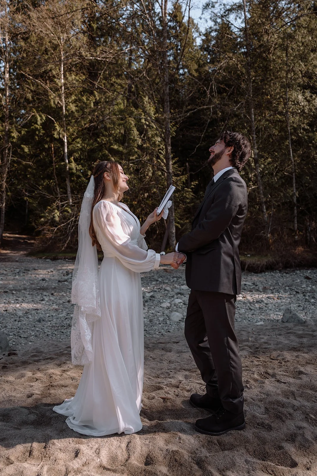 Bride and groom exchange private vows before their elopement