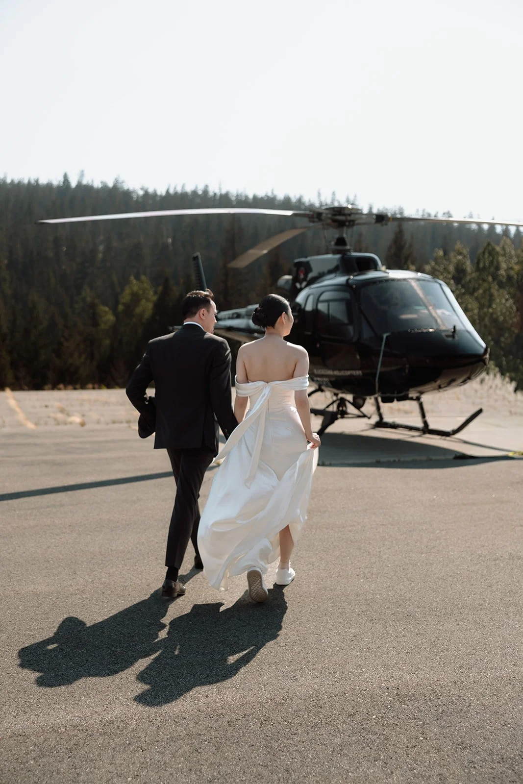 A couple preparing to get married during a helicopter elopement