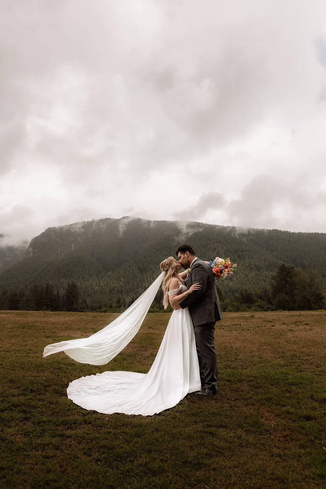 A couple kissing after their elopement at Lynn Valley in British Columbia