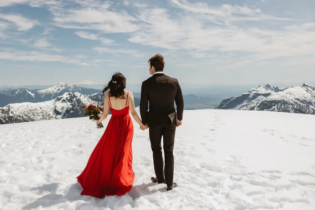 Romantic BC mountain elopement with couple exchanging vows surrounded by nature’s grandeur