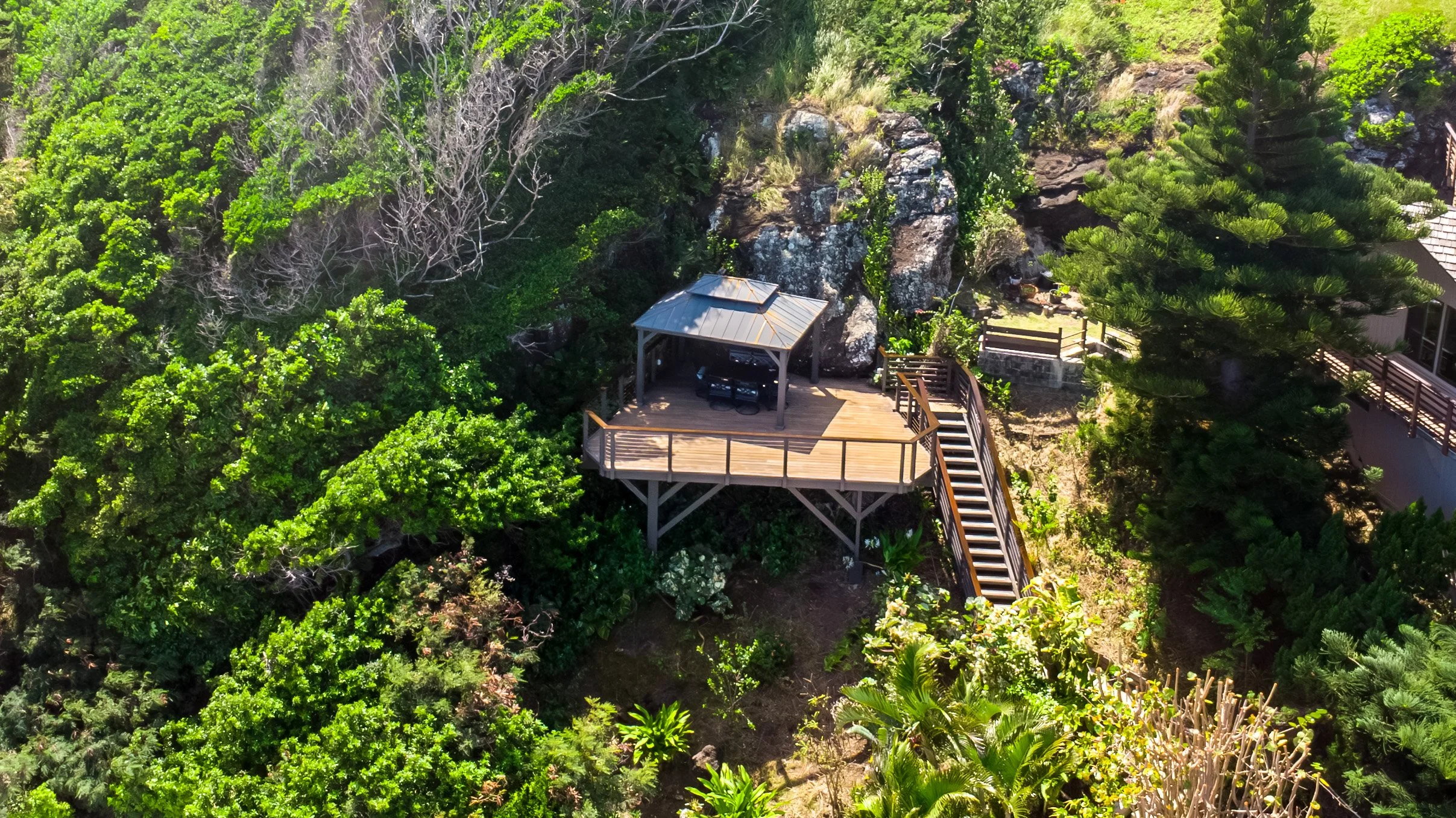 Permit has been approved for a 400-square-foot architecturally designed recreation room behind the main house, below the upper hillside viewing deck with a pergola.