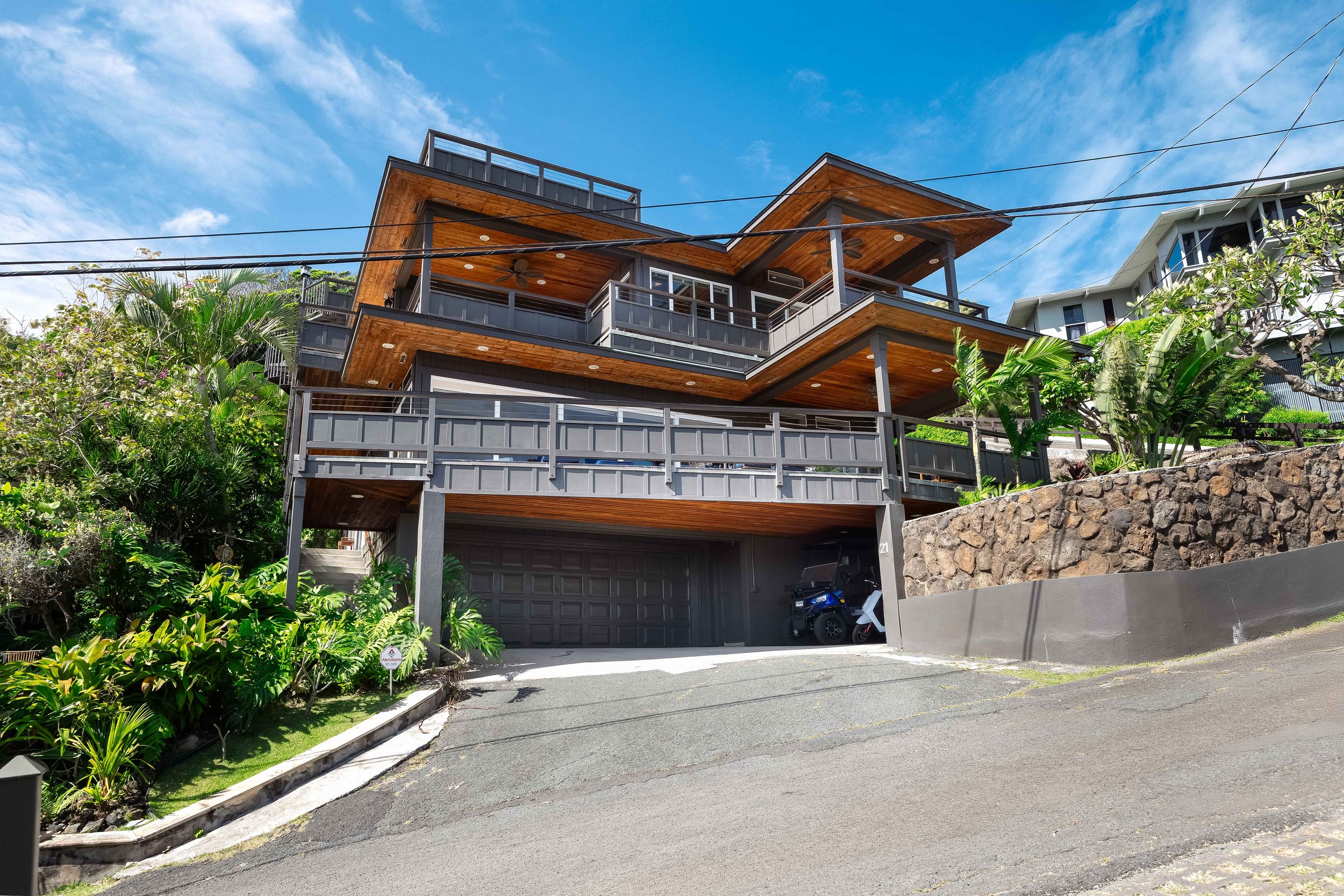 Oversized basement garage and covered carport provide ample parking and storage space.