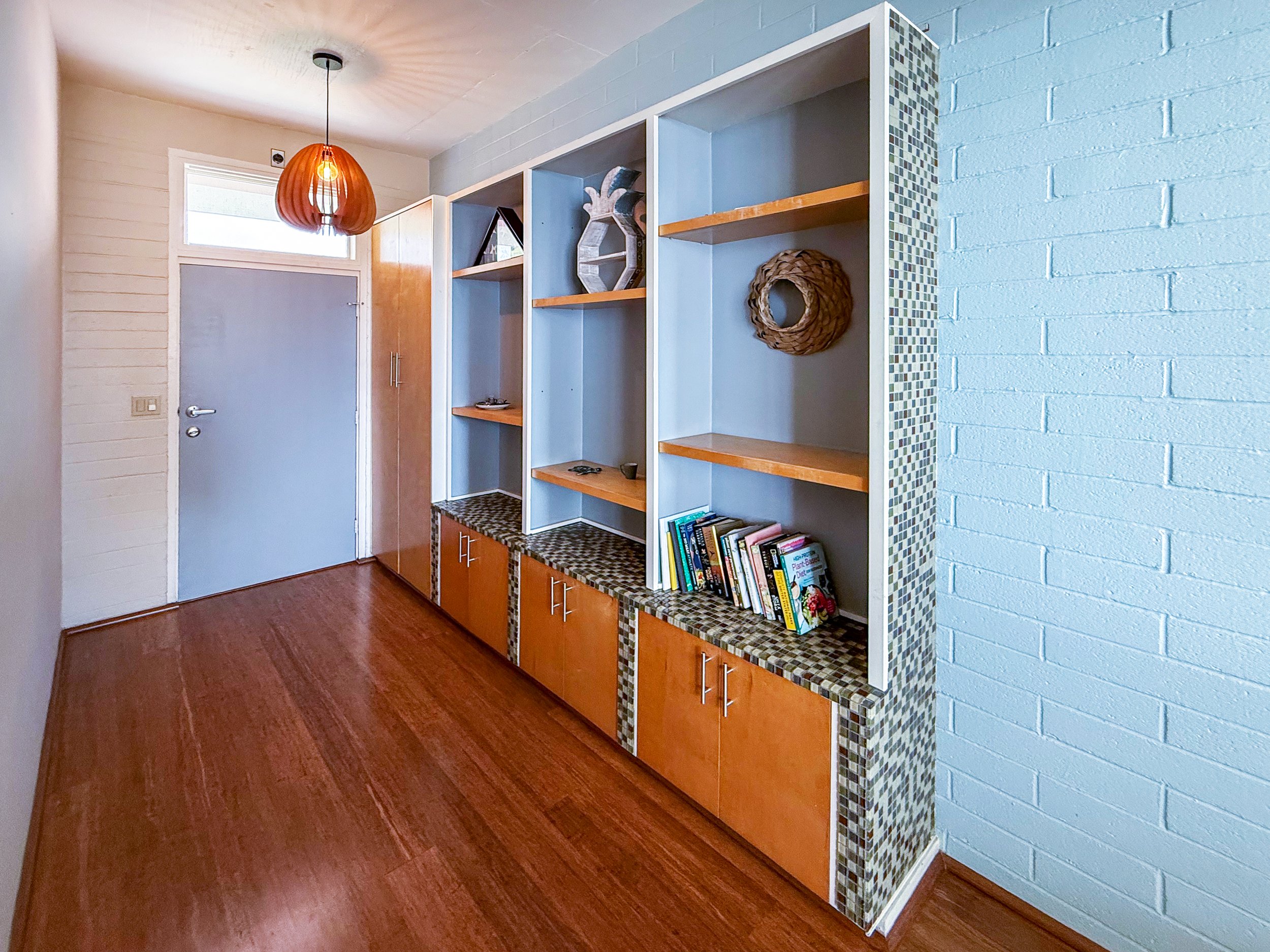 A built-in shelf/ closet in the hallway for additional storage.