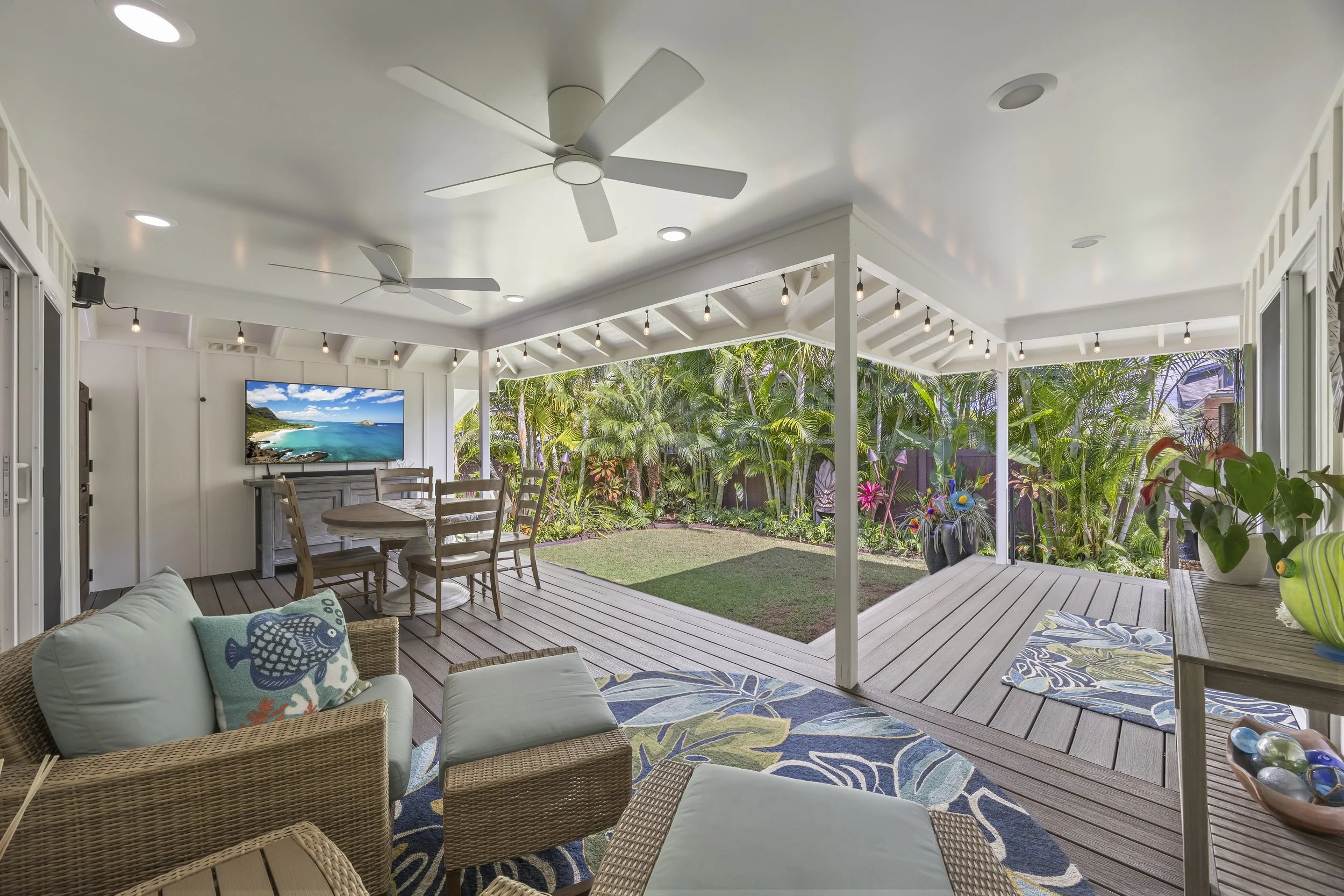 The covered lanai creates an inviting extension of the living space.