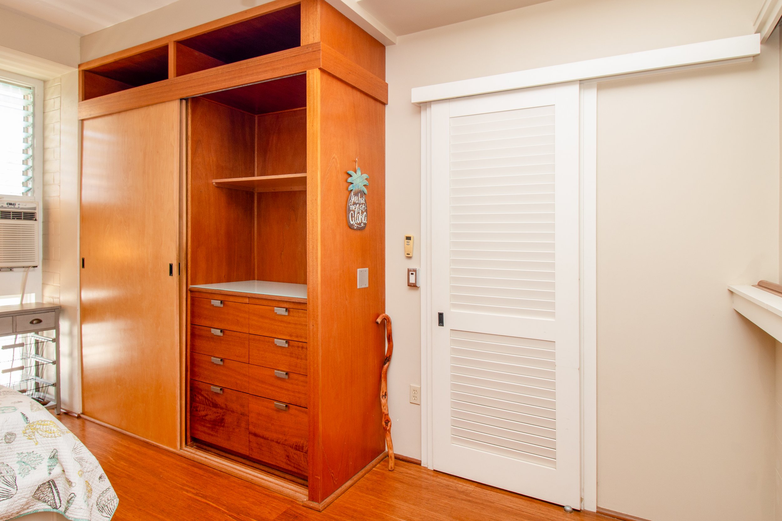 Custom closet with built-in drawers in the bedroom.