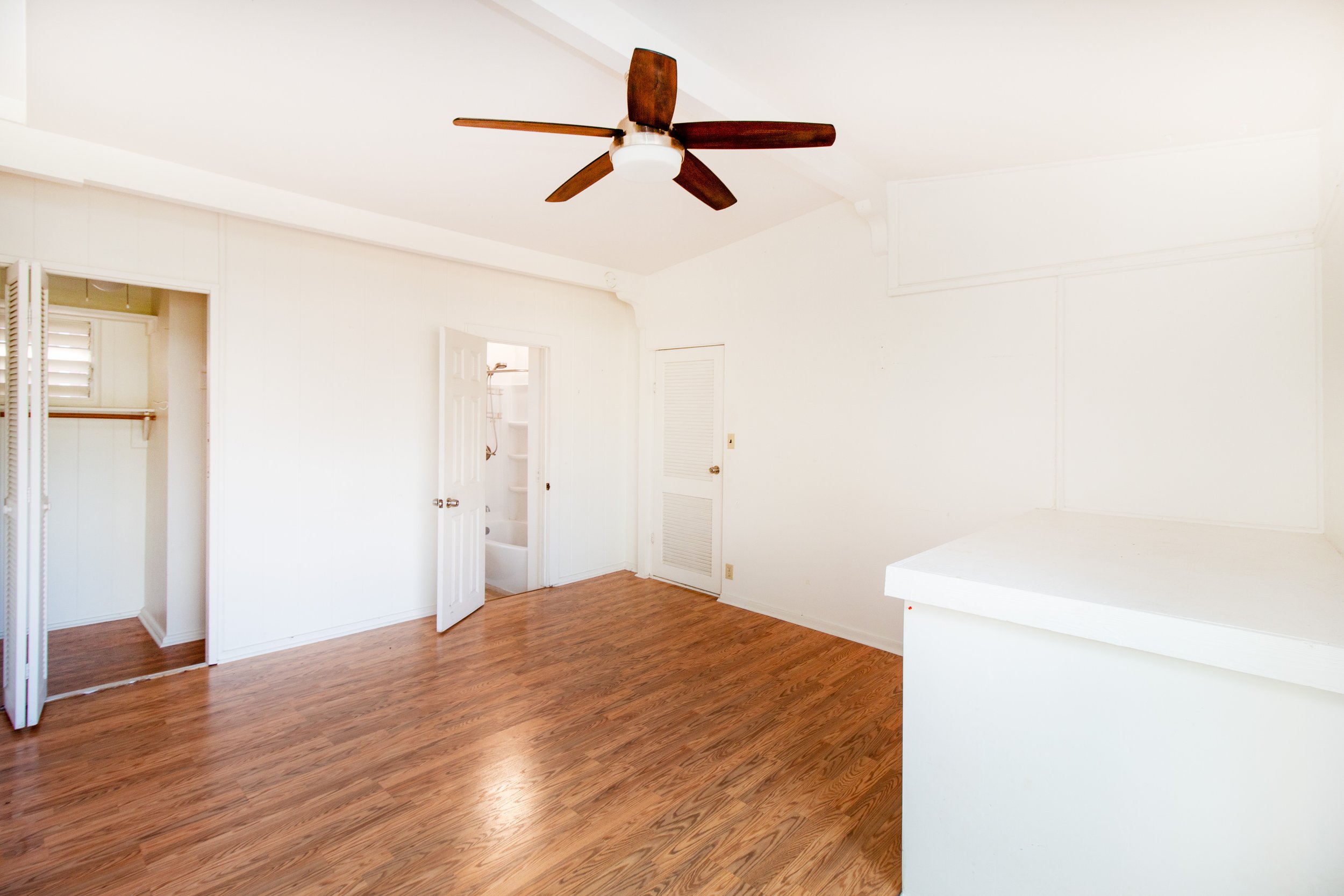 Primary bedroom with a walk-in closet and bathroom