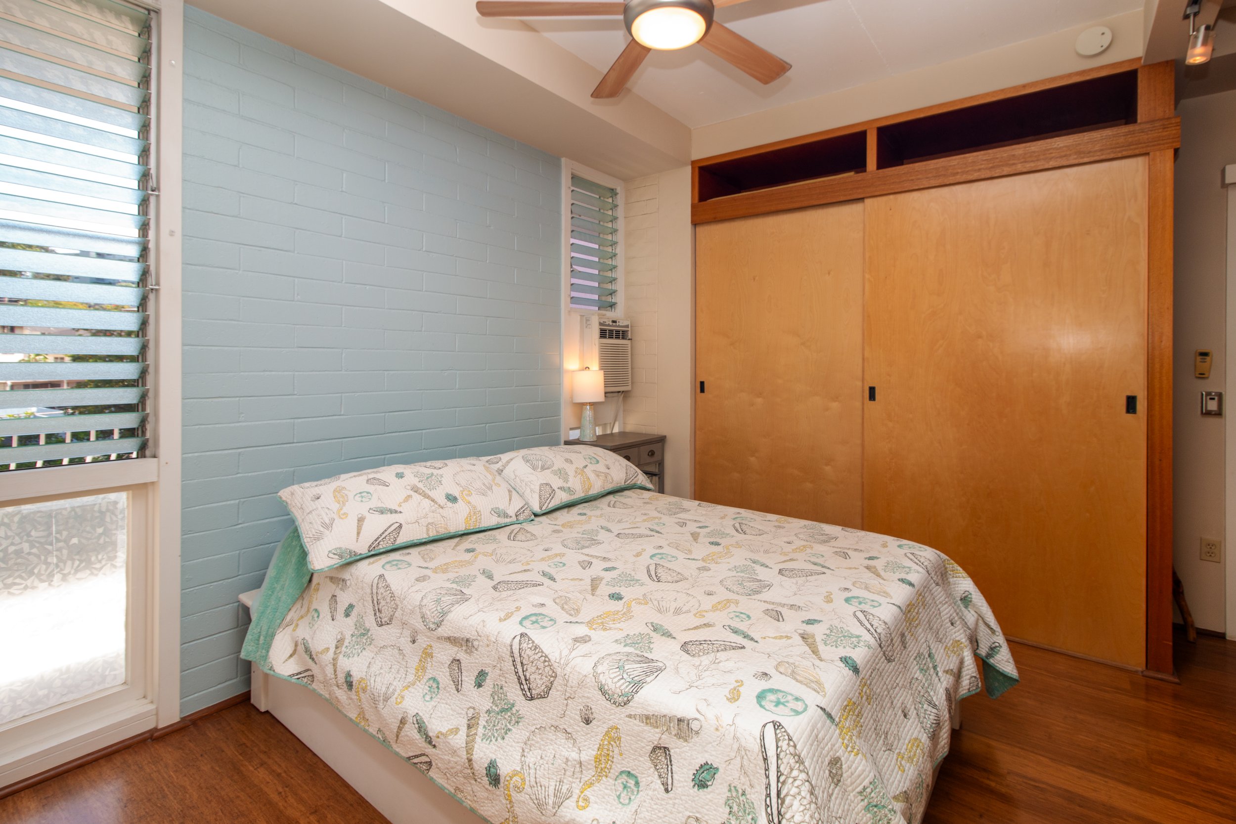 Bedroom with window AC.