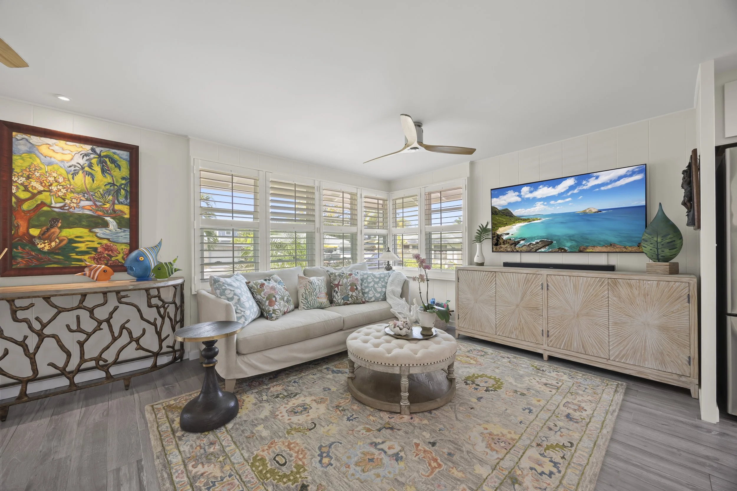 Custom double-hung windows with lifetime warranty and plantation shutters throughout, providing excellent airflow, privacy, and natural light