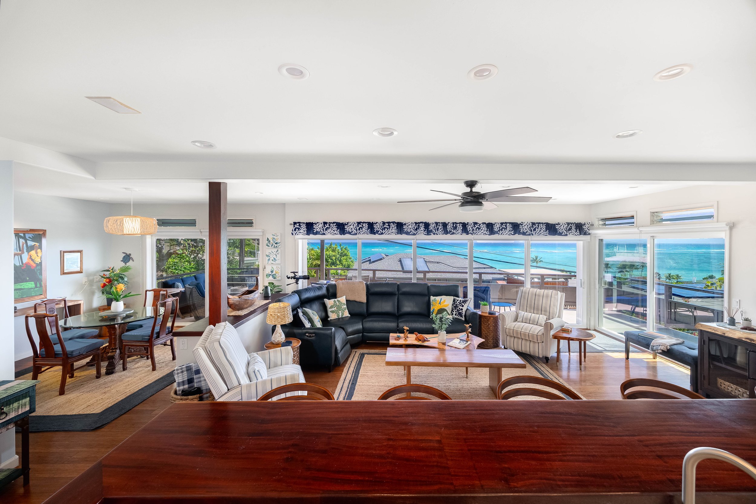 Open kitchen, dining and living areas with gorgeous views and access to a spacious lanai.