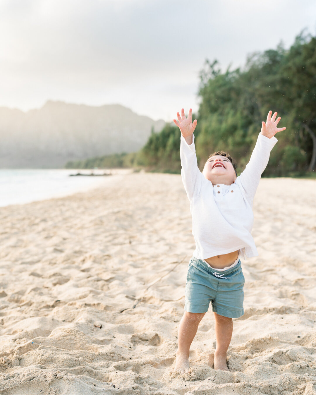 This was the second time photographing this trio - the first was for little Koa's first birthday.  I love that these parents just go with the flow with Koa and let him be himself.  This little guy LOVES the beach - and after this sunrise session, the