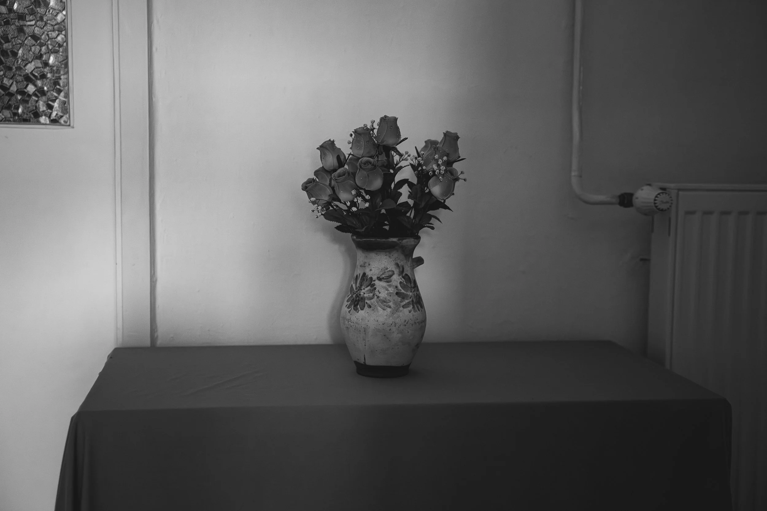 A found flower still life in the back hallway of the dormitory. 2025.