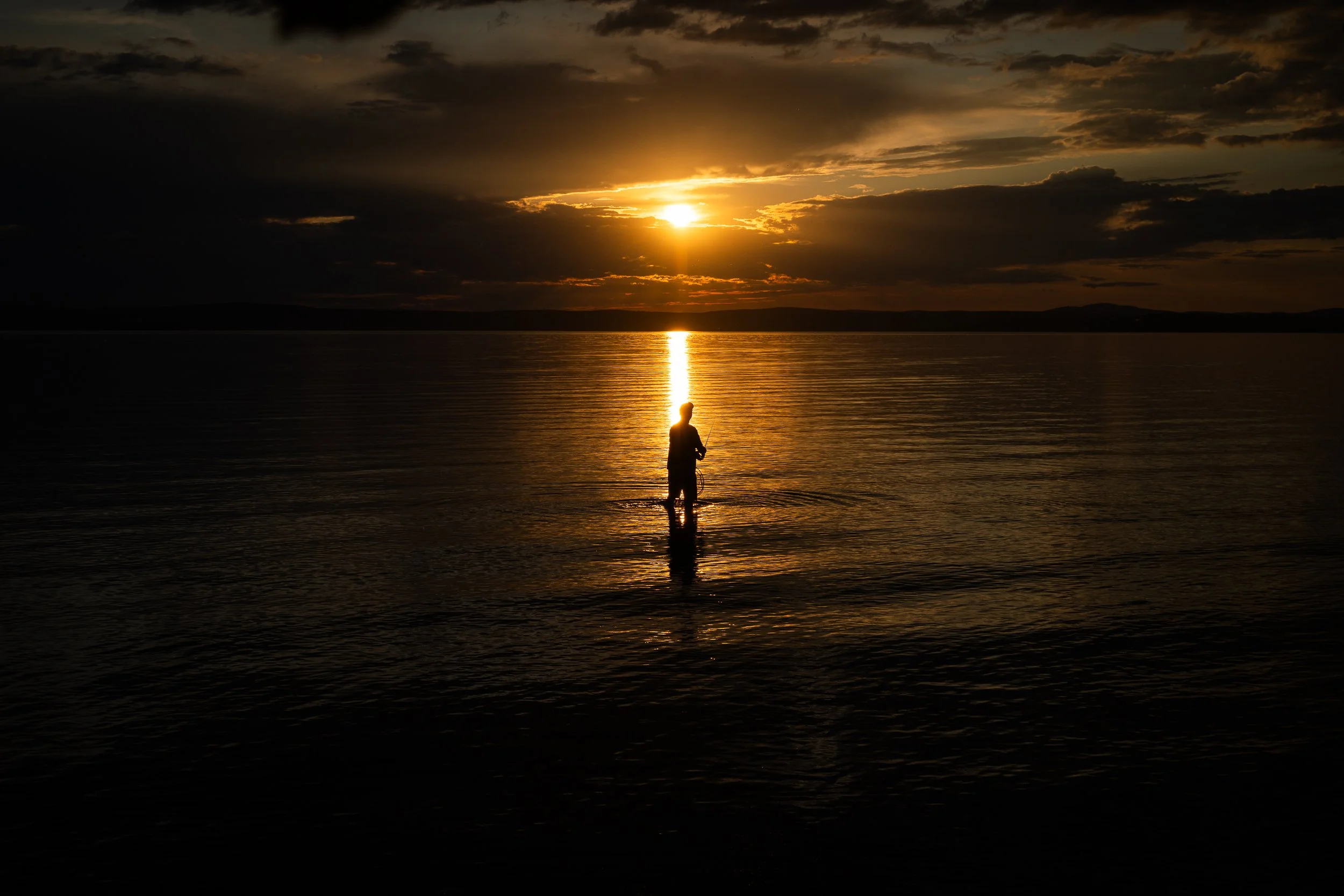 A man fishing in the area of a former communist resort used during the Kádár era