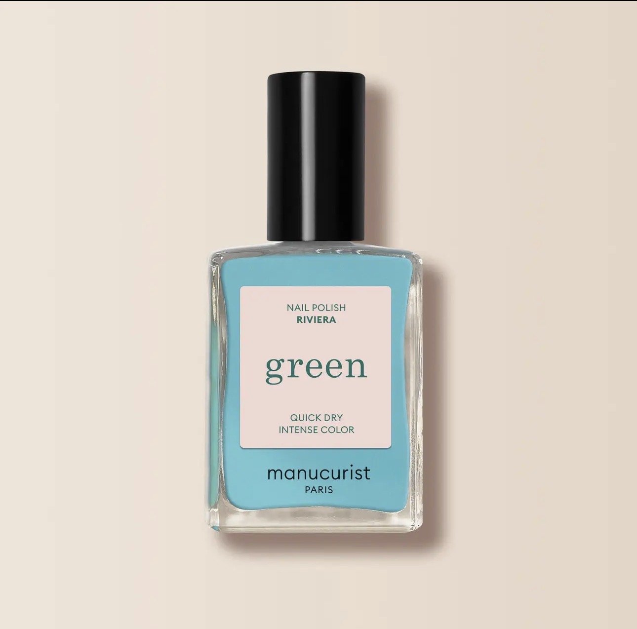 Bottle of Manicurist green nail polish with black cap on a light background.