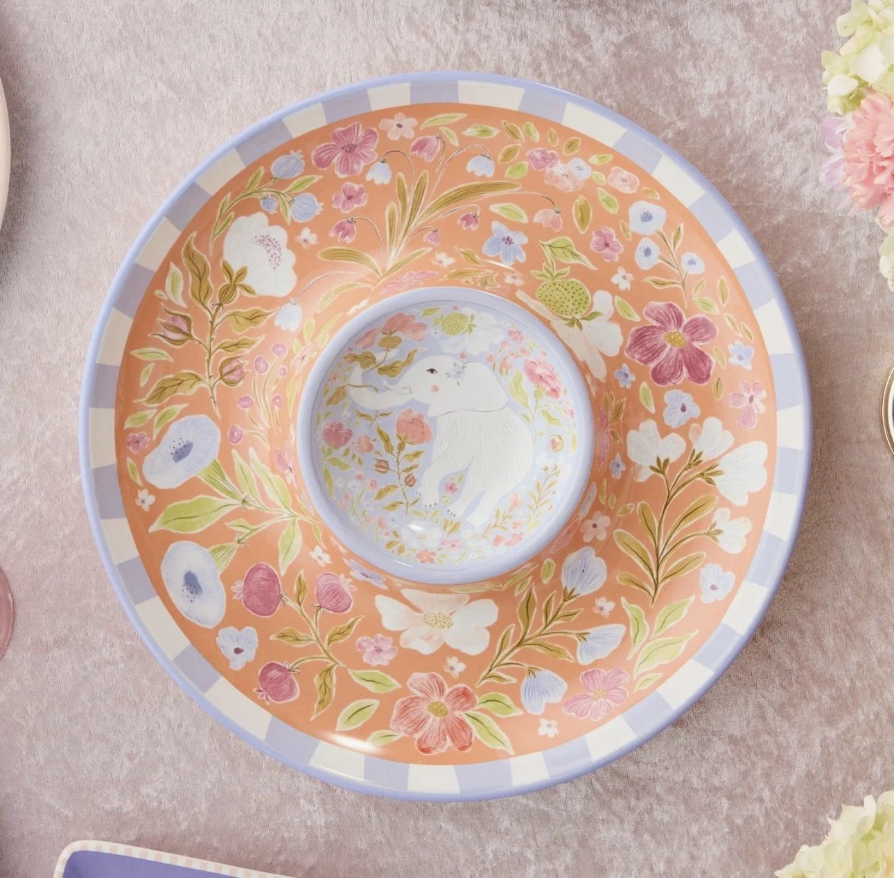 Decorative ceramic bowl with a pastel pink and blue floral design and a white rabbit illustration in the center.